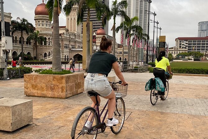 Cycling Through the Heart of Kuala Lumpur with Hotel Pickup - Petaling Street and two places of worship