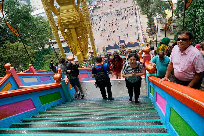 Private Half-Day Temples and Cultural Tour in Kuala Lumpur - Climbing the steps at Batu Caves